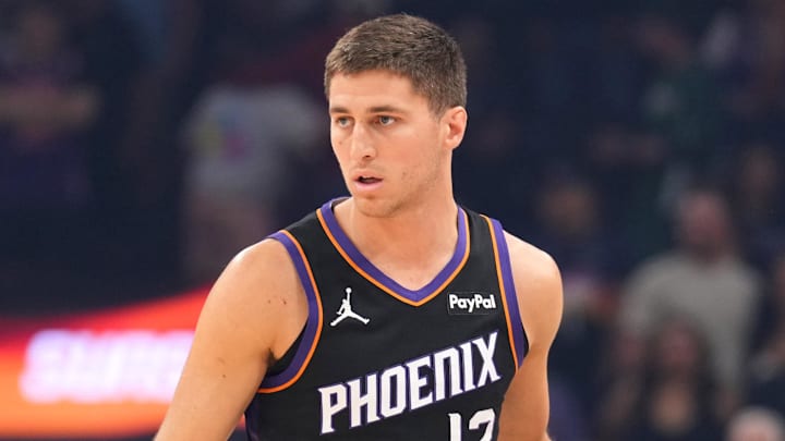 Mar 21, 2026; Phoenix, Arizona, USA; Phoenix Suns guard Collin Gillespie (12) dribbles against the Milwaukee Bucks during the first half at Mortgage Matchup Center. Mandatory Credit: Joe Camporeale-Imagn Images