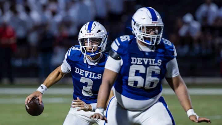 Leominster’s Osiris Lopez ventures out of the pocket as teammate, Julian Pereira-Vasquez defends.
