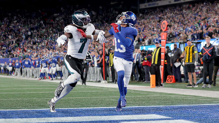 Oct 9, 2025; East Rutherford, New Jersey, USA; Philadelphia Eagles cornerback Kelee Ringo (7) commits pass interference against New York Giants wide receiver Jalin Hyatt (13) on a pass play during the fourth quarter at MetLife Stadium. Mandatory Credit: Brad Penner-Imagn Images