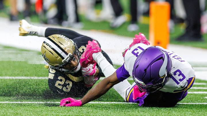 New Orleans Saints S Julian Blackmon (23) and Minnesota Vikings WR Tai Felton (13)