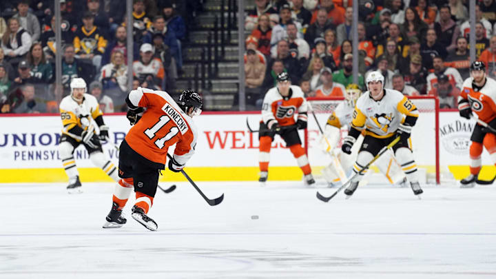 Feb 8, 2025; Philadelphia, Pennsylvania, USA; Philadelphia Flyers right wing Travis Konecny (11) shoots and scores a goal against the Pittsburgh Penguins in the third period at Wells Fargo Center.