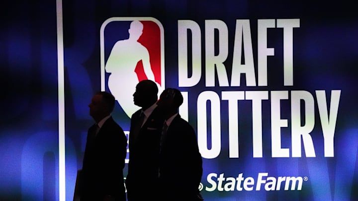 May 16, 2023; Chicago, IL, USA; People walk past the 2023 NBA Draft Lottery board at McCormick Place West. Mandatory Credit: David Banks-Imagn Images May 16, 2023; Chicago, IL, USA; People walk past the 2023 NBA Draft Lottery board at McCormick Place West. Mandatory Credit: David Banks-Imagn Images