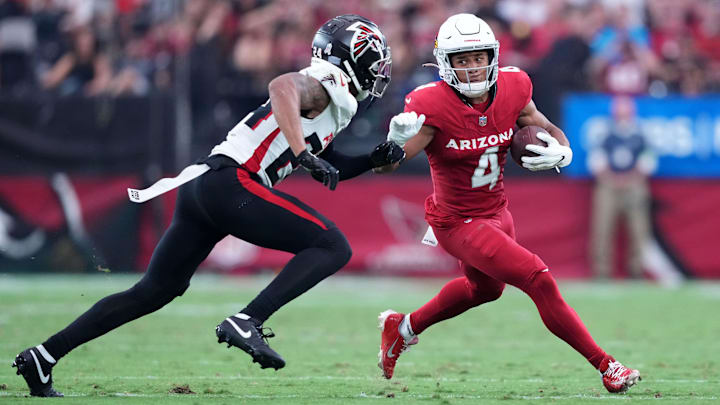 Nov 12, 2023; Glendale, Arizona, USA; Arizona Cardinals wide receiver Rondale Moore (4) runs against Atlanta Falcons cornerback A.J. Terrell (24) during the first half at State Farm Stadium. Mandatory Credit: Joe Camporeale-Imagn Images