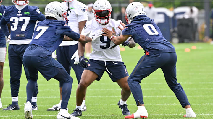 Jun 9, 2025; Foxborough, MA, USA; New England Patriots wide receiver Kayshon Boutte (9) works with cornerback Carlton Davis III (7) and cornerback Christian Gonzalez (0) during minicamp at Gillette Stadium. Mandatory Credit: Eric Canha-Imagn Images