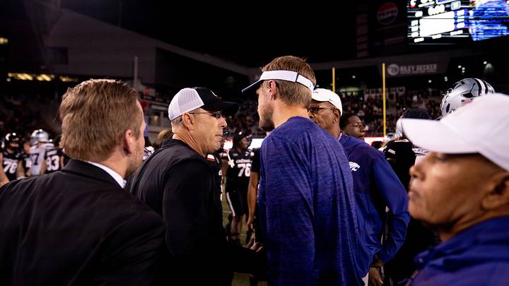 Cincinnati Bearcats head coach Scott Satterfield greets Kansas State Wildcats head coach Collin Klein after a Cincinnati Bearcats win at Nippert Stadium in Cincinnati on Saturday, September 26, 2026. Cincinnati Bearcats head coach Scott Satterfield greets Kansas State Wildcats head coach Collin Klein after a Cincinnati Bearcats win at Nippert Stadium in Cincinnati on Saturday, September 26, 2026.