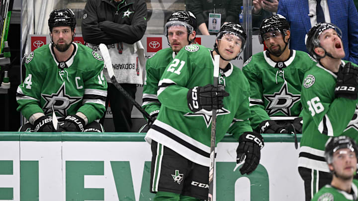 Apr 12, 2025; Dallas, Texas, USA; Dallas Stars left wing Jamie Benn (14) and center Roope Hintz (24) and left wing Jason Robertson (21) and defenseman Matt Dumba (3) and right wing Mikko Rantanen (96) look on as Benn’s goal against the Utah Hockey Club is under review during the third period at the American Airlines Center. Mandatory Credit: Jerome Miron-Imagn Images