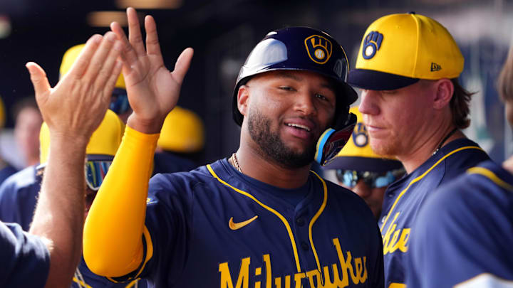 Feb 24, 2024; Peoria, Arizona, USA; Milwaukee Brewers center fielder Jackson Chourio (11) high fives