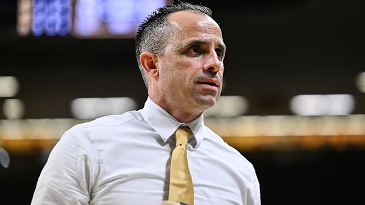 Iowa Hawkeyes head coach Ben McCollum Iowa Hawkeyes head coach Ben McCollum