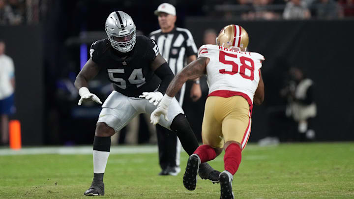 Las Vegas Raiders offensive tackle Jalen McKenzie (54) defends against  San Francisco 49ers defensive lineman Alex Barrett (58) in the first half at Allegiant Stadium during the 2024 preseason.