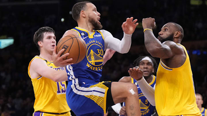 Golden State Warriors guard Stephen Curry (30) shoots the ball against Los Angeles Lakers guard Austin Reaves (15) and forward LeBron James (6) in the second half of game four of the 2023 NBA playoffs at Crypto.com Arena. Mandatory Credit: Kirby Lee-Imagn Images