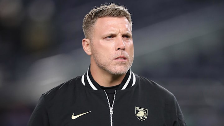 Nov 23, 2024; New York, New York, USA; Army Black Knights assistant coach Mike Viti walks the field before a game against the Notre Dame Fighting Irish at Yankee Stadium. Mandatory Credit: Danny Wild-Imagn Images