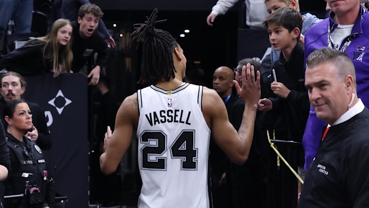 Mar 27, 2024; Salt Lake City, Utah, USA; San Antonio Spurs guard Devin Vassell (24) celebrates with fans after the game against the Utah Jazz at Delta Center.
