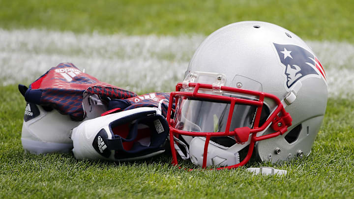Jul 30, 2015; Foxborough, MA, USA; A New England Patriots helmet, shoes and gloves sit on the field during training camp at Gillette Stadium. Mandatory Credit: Winslow Townson-Imagn Images