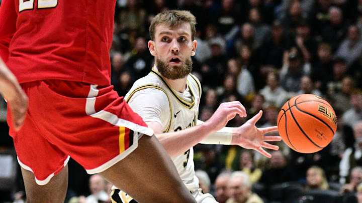 Purdue Boilermakers guard Braden Smith (3) looks to get the ball past Maryland Terrapins center Derik Queen (25) Purdue Boilermakers guard Braden Smith (3) looks to get the ball past Maryland Terrapins center Derik Queen (25)