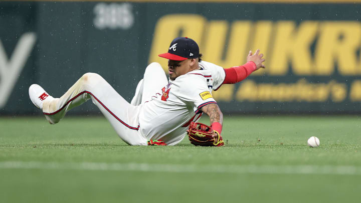 Apr 22, 2025; Cumberland, Georgia, USA; Former Atlanta Braves shortstop Orlando Arcia (11) makes an error in the field against the St. Louis Cardinals during the eighth inning at Truist Park. Apr 22, 2025; Cumberland, Georgia, USA; Former Atlanta Braves shortstop Orlando Arcia (11) makes an error in the field against the St. Louis Cardinals during the eighth inning at Truist Park.
