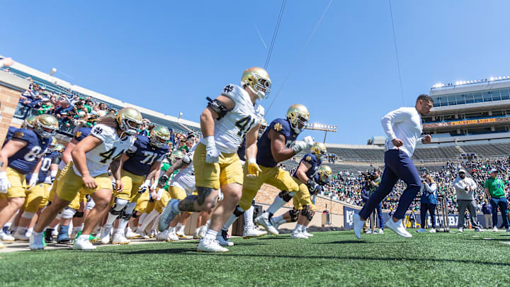 Apr 12, 2025; Notre Dame, IN, USA; Notre Dame Fighting Irish head coach Marcus Freeman leads the team onto the field during the Blue-Gold game at Notre Dame Stadium. Mandatory Credit: Michael Caterina-Imagn Images