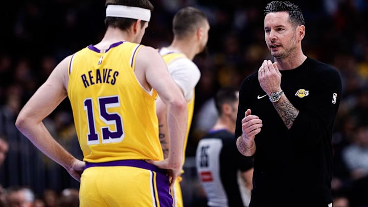  Los Angeles Lakers head coach JJ Redick talks with guard Austin Reaves (15) in the first quarter against the Denver Nuggets at Ball Arena.