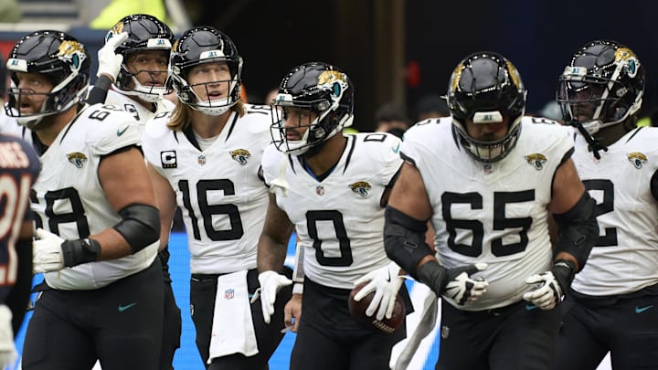 Oct 13, 2024; London, United Kingdom; Jacksonville Jaguars quarterback Trevor Lawrence (16) and 	Jacksonville Jaguars wide receiver Gabe Davis (0) and team mates celebrate a touchdown during the second half of an NFL International Series game at Tottenham Hotspur Stadium. 