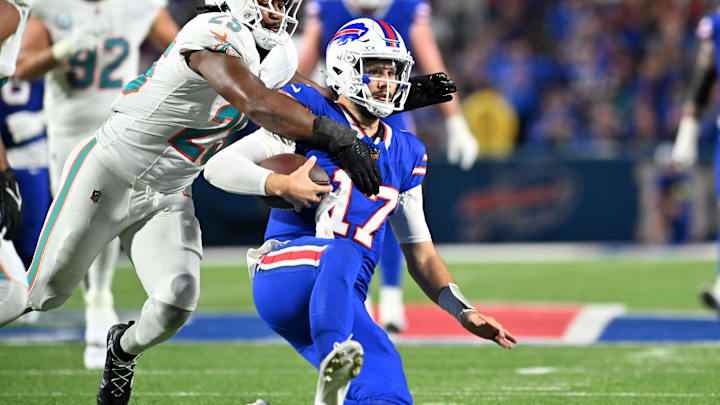 Dolphins cornerback Jack Jones (23) tackles Bills quarterback Josh Allen (17) in Week 3. Dolphins cornerback Jack Jones (23) tackles Bills quarterback Josh Allen (17) in Week 3.