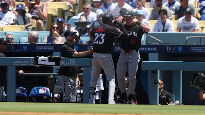 Jul 23, 2025; Los Angeles, California, USA; Minnesota Twins third baseman Royce Lewis (23) and Minnesota Twins outfielder Harrison Bader (12) celebrate a home run during the third inning against the Los Angeles Dodgers
at Dodger Stadium. Mandatory Credit: Kiyoshi Mio-Imagn Images