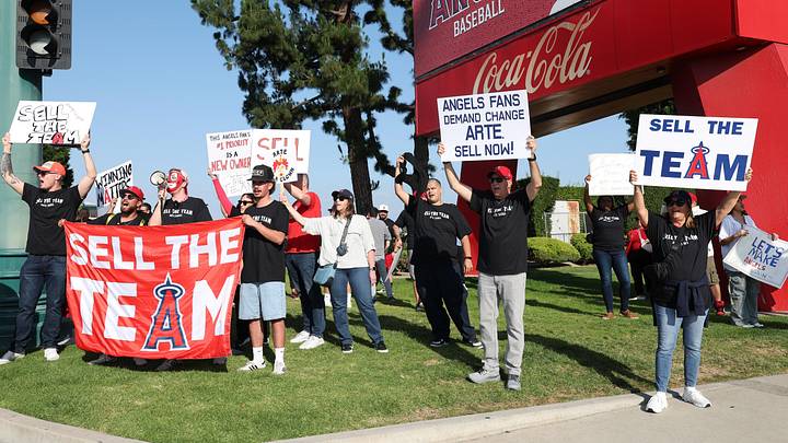May 23, 2026; Anaheim, California, USA;  Los Angeles Angels fans gather outside Angel Stadium before the game between the Los Angeles Angels and the Texas Rangers to protest the Angels team owner Arte Moreno. Mandatory Credit: Kiyoshi Mio-Imagn Images