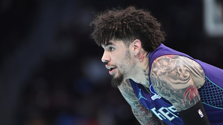 Nov 26, 2025; Charlotte, North Carolina, USA;  Charlotte Hornets guard LaMelo Ball (1) in a time out during the first half against the New York Knicks at the Spectrum Center. Mandatory Credit: Sam Sharpe-Imagn Images