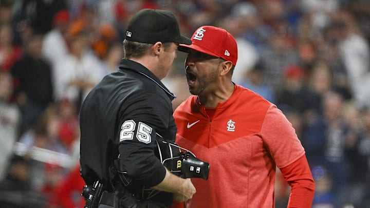 May 5, 2023; St. Louis, Missouri, USA;  St. Louis Cardinals manager Oliver Marmol (37)argues with umpire Junior Valentine (25) after he was ejected from the game during the ninth inning against the Detroit Tigers at Busch Stadium. Mandatory Credit: Jeff Curry-Imagn Images