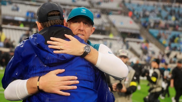Jacksonville Jaguars head coach Liam Coen hugs Indianapolis Colts head coach Shane Steichen (hc) after the game of an NFL football game at EverBank Stadium, Sunday, Dec. 7, 2025, in Jacksonville, Fla. The Jaguars defeated the Colts 36-19. [Corey Perrine/Florida Times-Union]