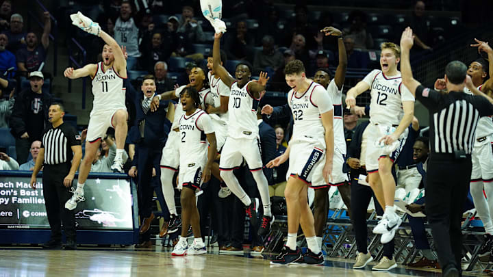 Nov 6, 2023; Storrs, Connecticut, USA; The UConn Huskies bench reacts after a three-point basket by walk-on guard Andrew Hurley (20) (not pictured) against the Northern Arizona Lumberjacks in the second half at Harry A. Gampel Pavilion. Mandatory Credit: David Butler II-Imagn Images Nov 6, 2023; Storrs, Connecticut, USA; The UConn Huskies bench reacts after a three-point basket by walk-on guard Andrew Hurley (20) (not pictured) against the Northern Arizona Lumberjacks in the second half at Harry A. Gampel Pavilion. Mandatory Credit: David Butler II-Imagn Images