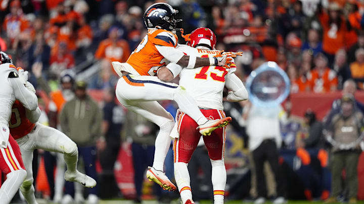 Nov 16, 2025; Denver, Colorado, USA; Denver Broncos cornerback Ja'Quan McMillian (29) sacks Kansas City Chiefs quarterback Patrick Mahomes (15) in the fourth quarter at Empower Field at Mile High. Mandatory Credit: Ron Chenoy-Imagn Images