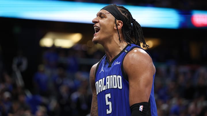 Apr 15, 2025; Orlando, Florida, USA;  Orlando Magic forward Paolo Banchero (5) reacts after a play against the Atlanta Hawks in the fourth quarter at Kia Center. Mandatory Credit: Nathan Ray Seebeck-Imagn Images
