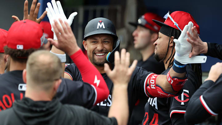 Feb 24, 2025; Port Charlotte, Florida, USA; Minnesota Twins third base Royce Lewis (23) celebrates with teammates after hitting a home run against the Tampa Bay Rays during the second inning at Charlotte Sports Park.