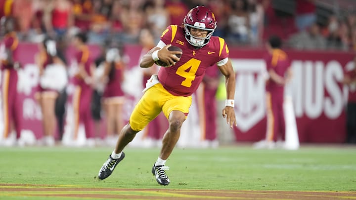 Aug 30, 2025; Los Angeles, California, USA; Southern California Trojans quarterback Husan Longstreet (4) carries the ball against the Missouri State Bears in the second half at United Airlines Field at Los Angeles Memorial Coliseum. Mandatory Credit: Kirby Lee-Imagn Images