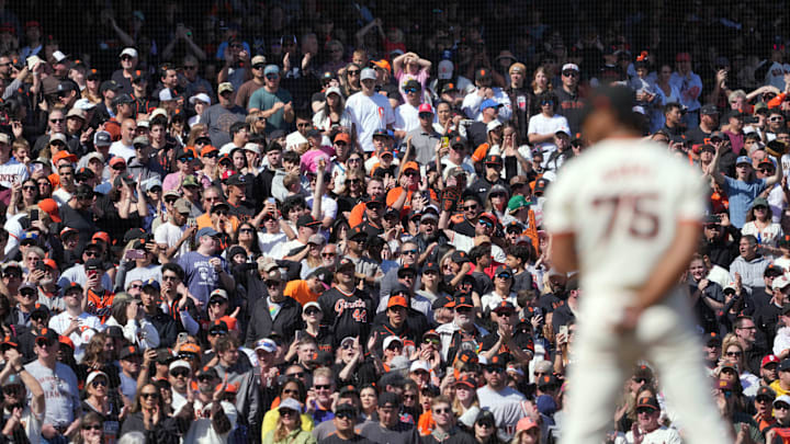 San Francisco, California, USA; San Francisco Giants fans applaud as pitcher Camilo Doval (75) prepares to pitch during the ninth inning against the San Diego Padres at Oracle Park.