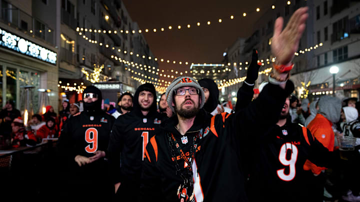 Tyler Pitzer, a Bengals fan, signals a first down while watch the AFC Championship game between the
