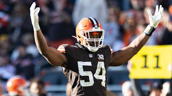 Nov 19, 2023; Cleveland, Ohio, USA; Cleveland Browns defensive end Ogbo Okoronkwo (54) raises his arms to pump up the crowd against the Pittsburgh Steelers during the third quarter at Cleveland Browns Stadium. Mandatory Credit: Scott Galvin-Imagn Images