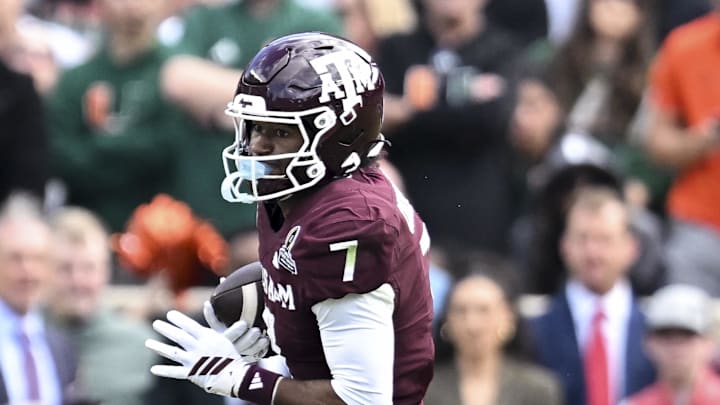 Dec 20, 2025; College Station, TX, USA; Texas A&M Aggies wide receiver KC Concepcion (7) runs the ball against the Miami Hurricanes during the second half at Kyle Field. Mandatory Credit: Maria Lysaker-Imagn Images