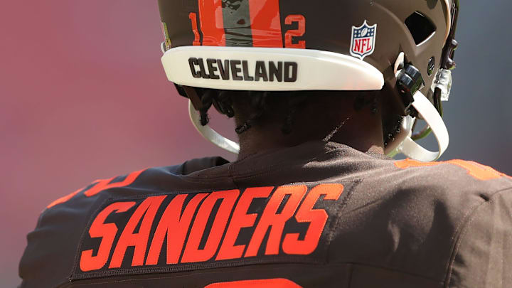 Cleveland Browns quarterback Shedeur Sanders is seen on the sideline wearing the team’s alternate Alpha Dawg helmet before an NFL football game at Huntington Bank Field, Sept. 21, 2025, in Cleveland, Ohio. Cleveland Browns quarterback Shedeur Sanders is seen on the sideline wearing the team’s alternate Alpha Dawg helmet before an NFL football game at Huntington Bank Field, Sept. 21, 2025, in Cleveland, Ohio.