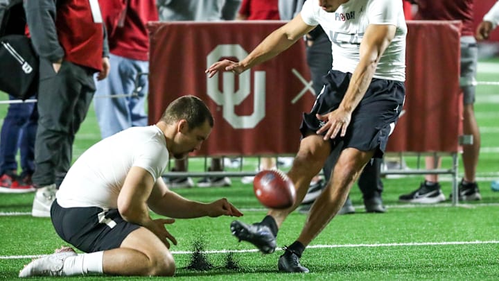 Gabe Brkic and Michael Turk run drills during OU Pro Day for University of Oklahoma football players