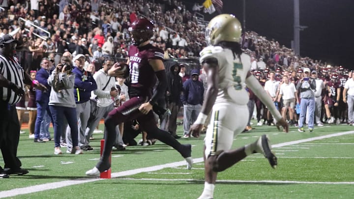 Benedictine quarterback Stephen Cannon slips into the end zone for a touchdown against Ware County on Friday October 11, 2024 at Memorial Stadium.