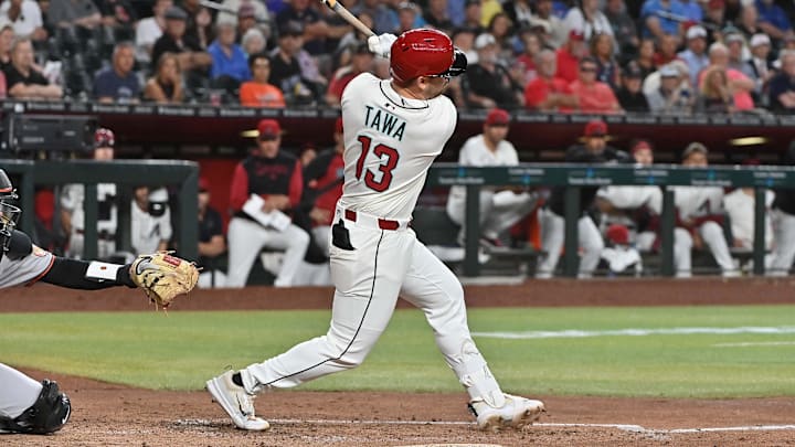 Apr 9, 2025; Phoenix, Arizona, USA; Arizona Diamondbacks second base Tim Tawa (13) hits an two RBI single in the fifth inning against the Baltimore Orioles at Chase Field. Mandatory Credit: Matt Kartozian-Imagn Images Apr 9, 2025; Phoenix, Arizona, USA; Arizona Diamondbacks second base Tim Tawa (13) hits an two RBI single in the fifth inning against the Baltimore Orioles at Chase Field. Mandatory Credit: Matt Kartozian-Imagn Images