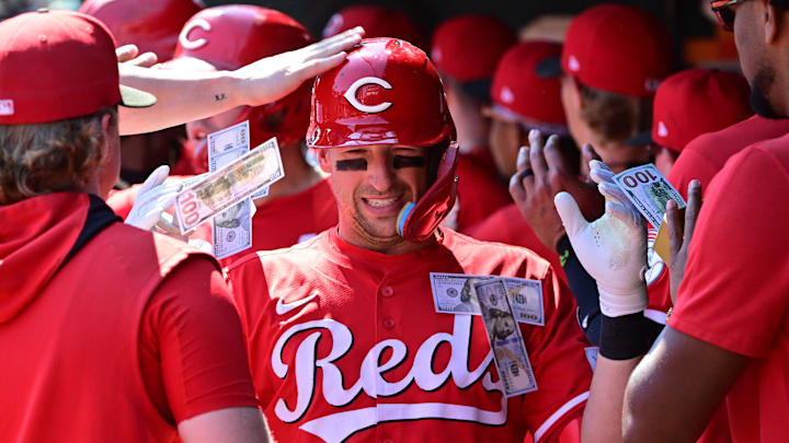 Sep 17, 2025; St. Louis, Missouri, USA; Cincinnati Reds teammates shower Cincinnati Reds first baseman Spencer Steer (7) with money in the dugout after he hit a three-run home run against the St. Louis Cardinals at Busch Stadium. Mandatory Credit: Tim Vizer-Imagn Images