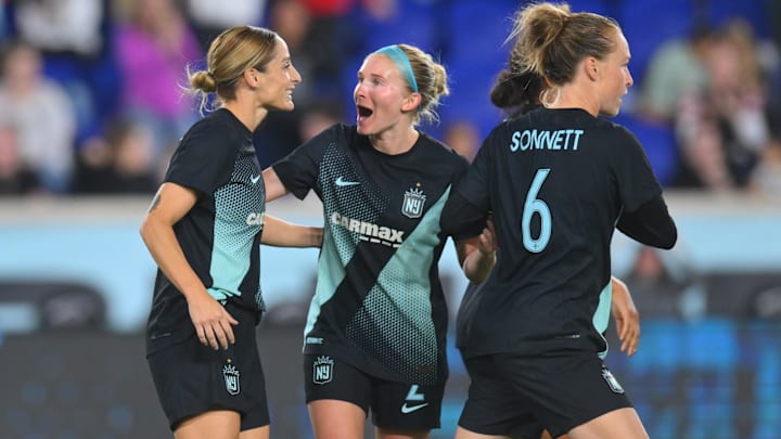 Gotham FC forward Esther Gonzalez (9) celebrates with midfielder Jenna Nighswonger (2) and midfielder Emily Sonnett (6) following a second half goal against Bay FC