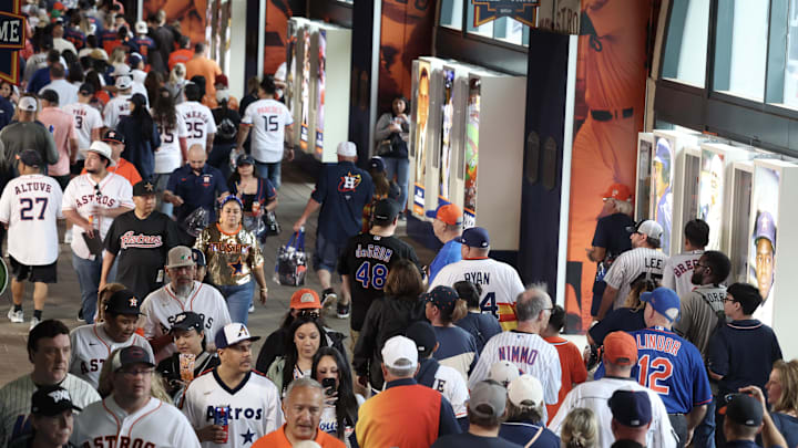 Mar 27, 2025; Houston, Texas, USA;  Fans walk the corridor before the New York Mets play the Houston Astros at Daikin Park.