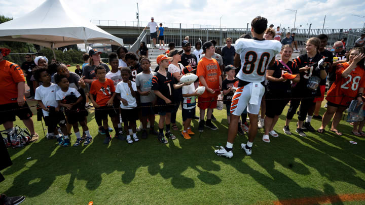 Cincinnati Bengals wide receiver Andrei Iosivas (80) signs autographs at the Cincinnati Bengals NFL training camp practice in Cincinnati on Thursday, Aug. 3, 2023. Cincinnati Bengals wide receiver Andrei Iosivas (80) signs autographs at the Cincinnati Bengals NFL training camp practice in Cincinnati on Thursday, Aug. 3, 2023.