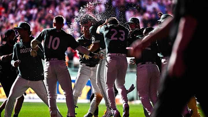 Aug 1, 2025; Boston, Massachusetts, USA; Boston Red Sox left fielder Roman Anthony (19) gets doused in water after hitting a game winning RBI during the tenth inning inning against the Houston Astros at Fenway Park. Mandatory Credit: Eric Canha-Imagn Images