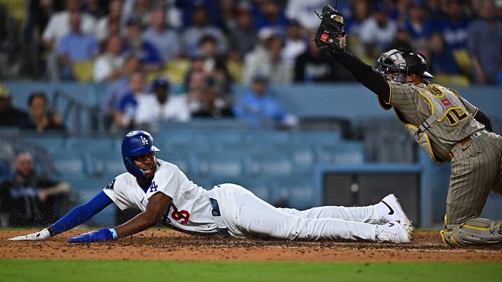 Sep 22, 2026; Los Angeles, California, USA; Los Angeles Dodgers designated hitter Josue De Paula (95) is tagged out at home by San Diego Padres catcher Luis Campusano (12) during the seventh inning at Dodger Stadium. Mandatory Credit: William Liang-Imagn Images Sep 22, 2026; Los Angeles, California, USA; Los Angeles Dodgers designated hitter Josue De Paula (95) is tagged out at home by San Diego Padres catcher Luis Campusano (12) during the seventh inning at Dodger Stadium. Mandatory Credit: William Liang-Imagn Images