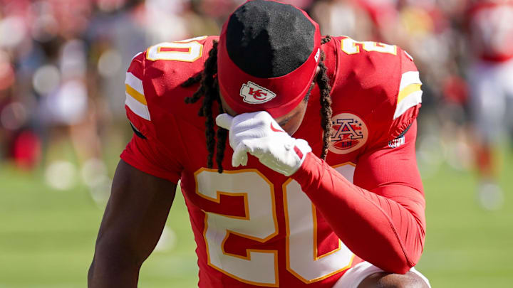 Sep 28, 2025; Kansas City, Missouri, USA; Kansas City Chiefs cornerback Nohl Williams (20) kneels in the end zone against the Baltimore Ravens prior to a game at GEHA Field at Arrowhead Stadium.