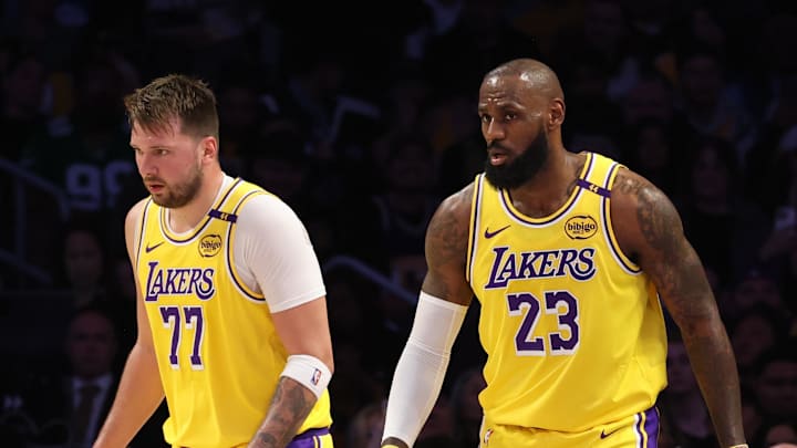 Feb 19, 2025; Los Angeles, California, USA; Los Angeles Lakers forward LeBron James (23) and guard Luka Doncic (77) during the first quarter against the Charlotte Hornets at Crypto.com Arena. Mandatory Credit: Jason Parkhurst-Imagn Images