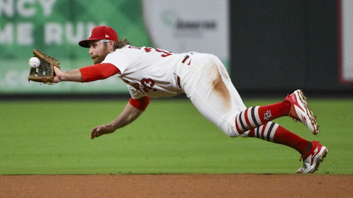 Aug 12, 2025; St. Louis, Missouri, USA;  St. Louis Cardinals second baseman Brendan Donovan (33) dives and catches a line drive hit by Colorado Rockies center fielder Brenton Doyle (not pictured) during the seventh inning at Busch Stadium. Mandatory Credit: Jeff Curry-Imagn Images